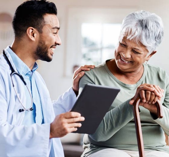 A doctor sharing results with a smiling older patient